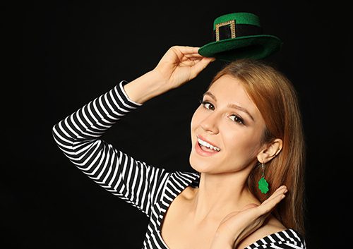 Pretty lady in stripe blouse going to St. Patrick's Day