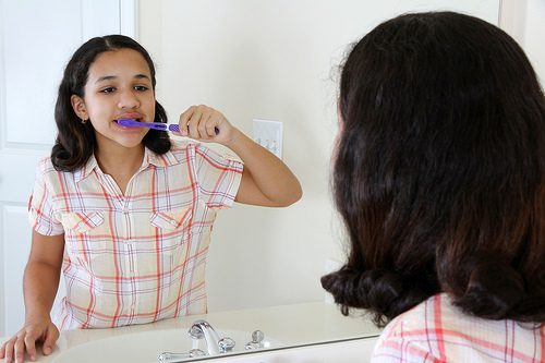 A girl brushing her teeth